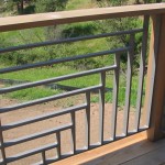 Intersecting Horizontal and Vertical Metal Slat Railing